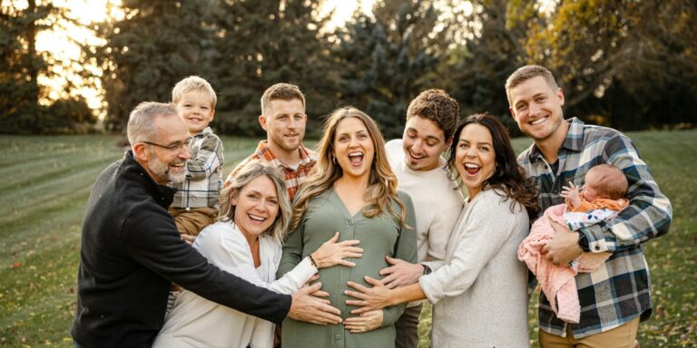 A joyful multigenerational family celebrating a new baby on the way